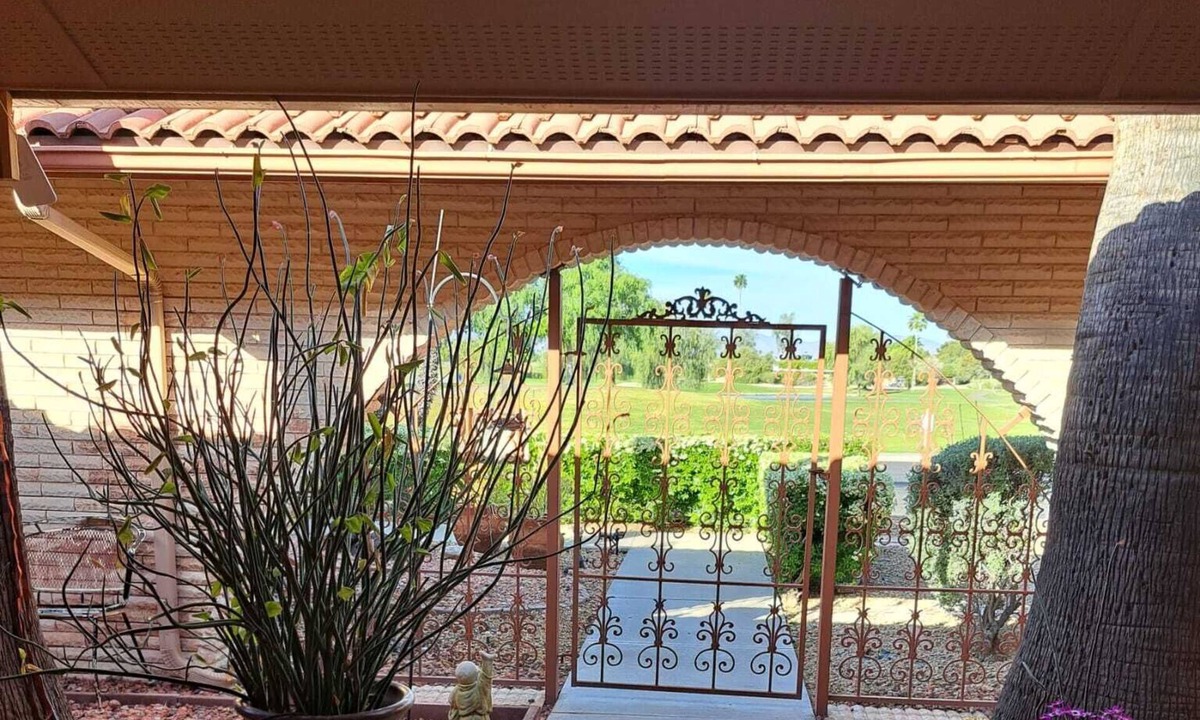 Sun City West House | Golf course view home with a private backyard oasis