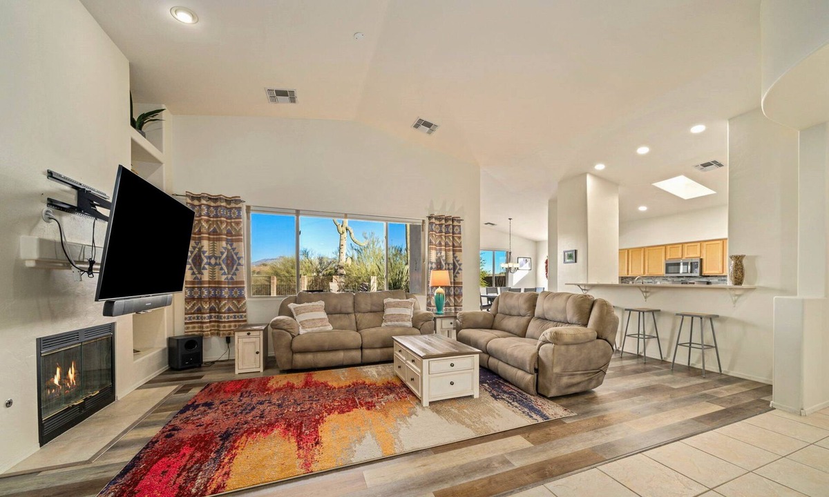 Dove Mountain House | Remodeled modern beauty backs to open desert with mountain views & home theatre