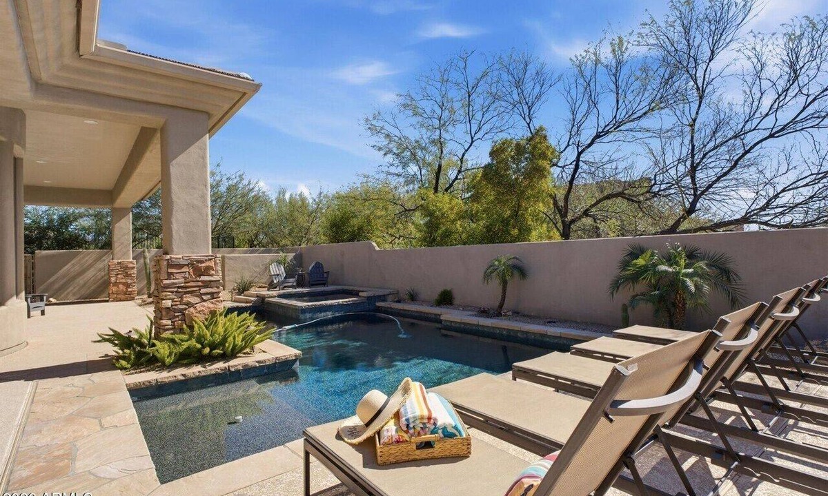 Troon North House | The Home is located in Troon north Pool spa bbq island kitchen single level home