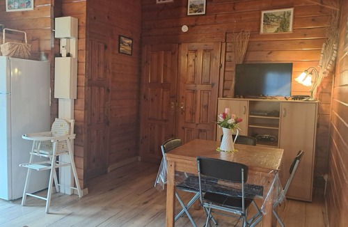 Poggiolo Ski Chalet | Chalet garden between hiking maquis swimming