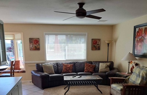 Sun City West House | Golf course view home with a private backyard oasis