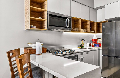 Fluvial Vallarta Condo | Modern condo with rooftop pool, balcony, gas grill & gym access