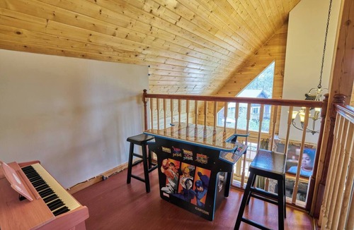 Whispering Forest Cabin | No Better Escape than Our Private Lot with Relaxing Deck, Firepit table, 3BR w/Game Loft, Pac Man tabletop games console!