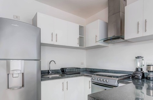 Puerto Juarez Apartment | Relaxing Family Home: Pool, BBQ & Kids' Playground