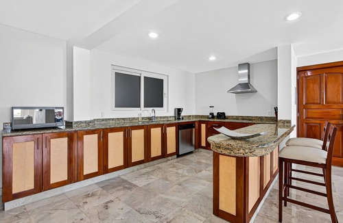 Conchas Chinas Apartment | Stylish oceanview suite with infinity pool, full kitchen & bay-view terrace