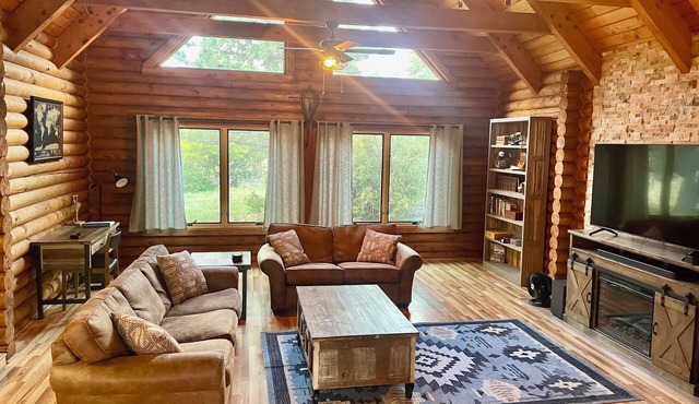 Cheerful Cabin with large stone patio and hot tub, next to trails!