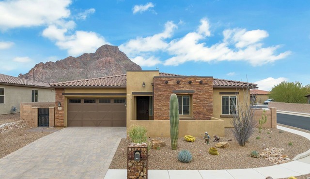 Gorgeous custom home with spa, heated pool, outdoor kitchen and game room!