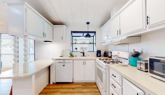 Inviting dog-friendly home with pool, tennis, grill, patio, central AC, & W/D