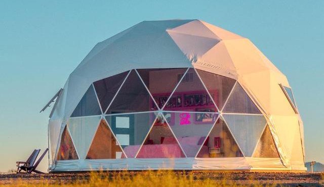 Luminous Cozy Dome with a Barbie Collection Above Bed in Willcox, Arizona