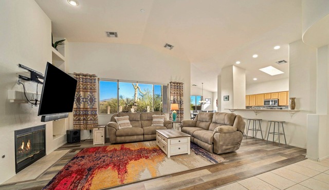 Remodeled modern beauty backs to open desert with mountain views & home theatre