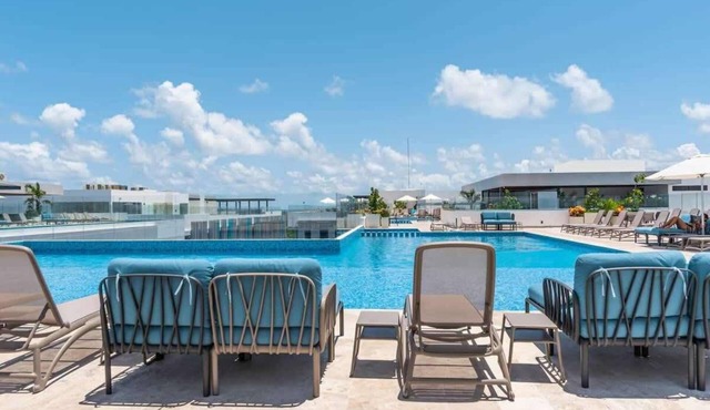 Rooftop Pools and Ocean Views in Central Playa Condo