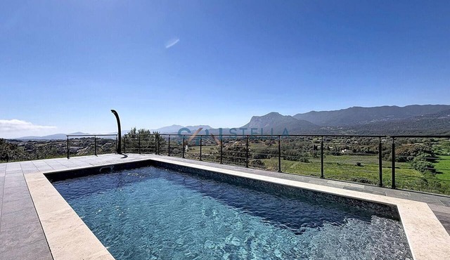 Upper floor of a villa with a private pool and views of the sea and mountains