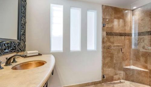 Junior King Suite with Partial Pool View and Balcony